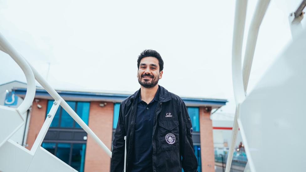 ON THE PLANE : Ilkay boards the plane