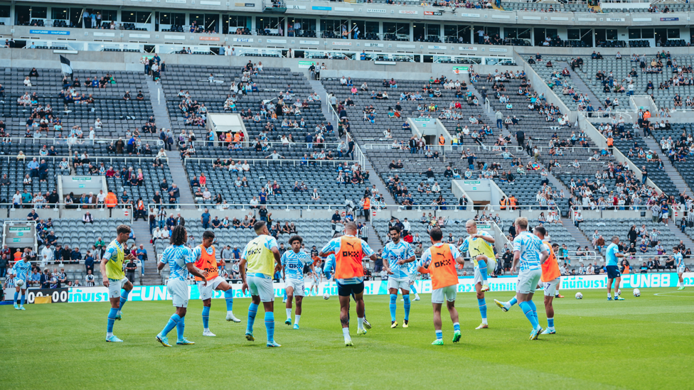 WARM UP : The players get loose during the pre-match warm up.