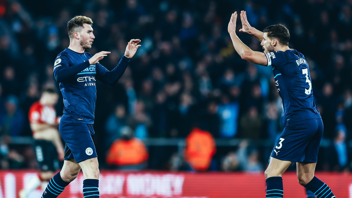 DEFENSIVE DUO: Dias celebrates with Laporte after the equaliser.