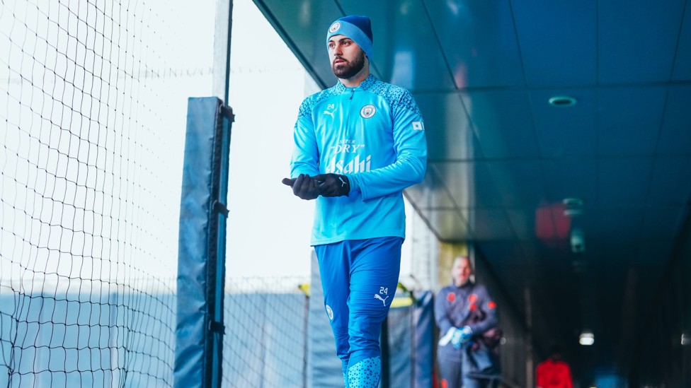 PROTECTED FROM THE ELEMENTS : Josko Gvardiol wraps up warm ahead of training