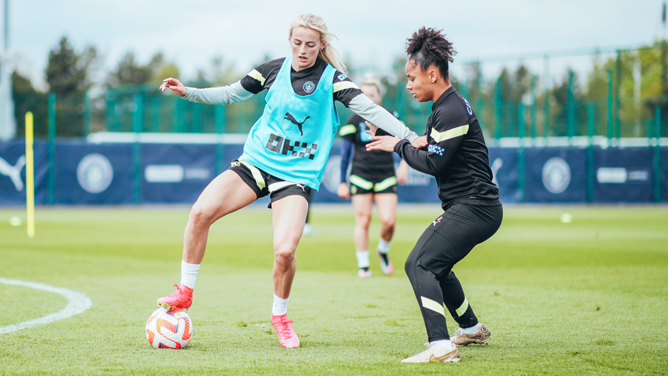 UNDER PRESSURE : Demi Stokes working hard to regain possession from Chloe Kelly. 