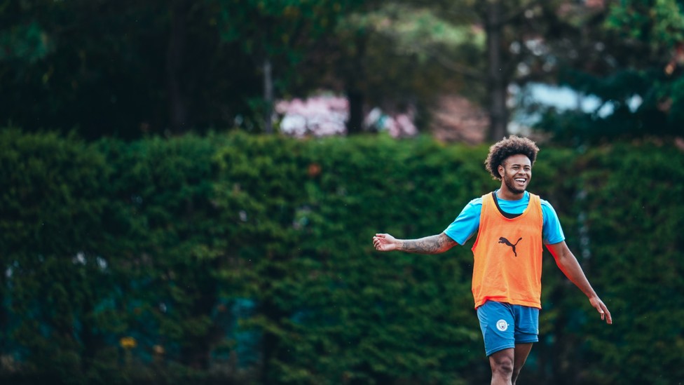 ALL SMILES : Tai Sodje making his way out on to the City Football Academy training pitches. 