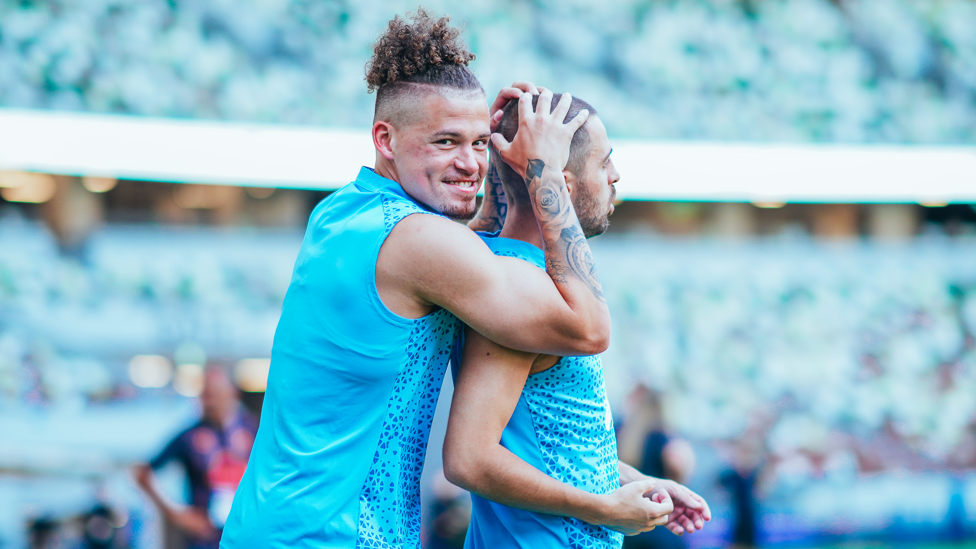 BLUES BROTHERS: Kalvin Phillips gives a freshly shorn Bernardo Silva an affectionate hug