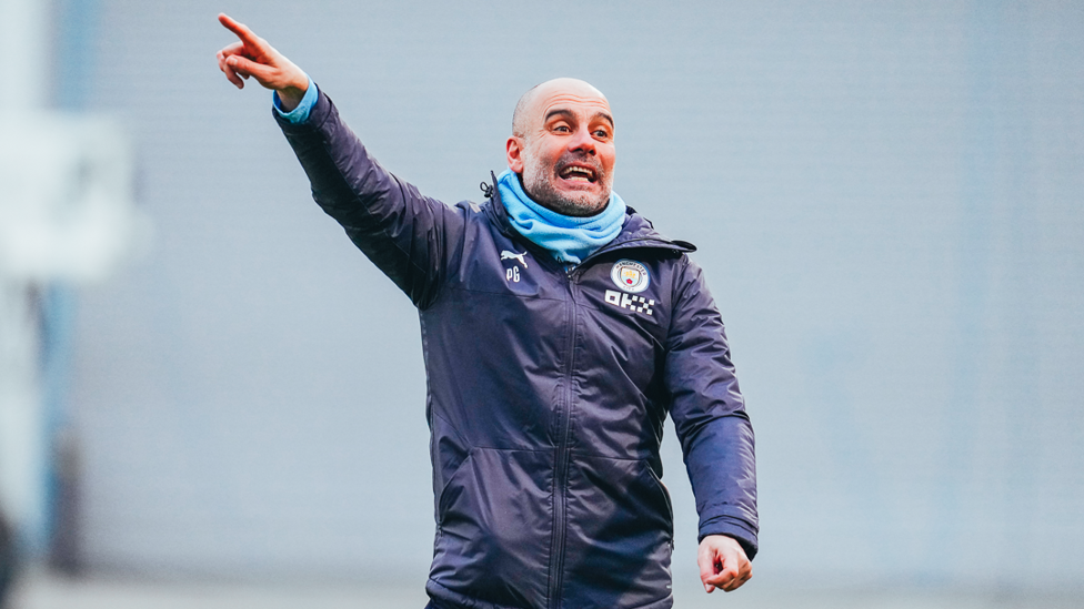 THE BOSS : Pep Guardiola instructs his players out on the training field