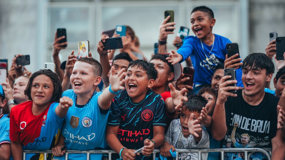 BEST IN THE LAND  : Supporters greet City's players.