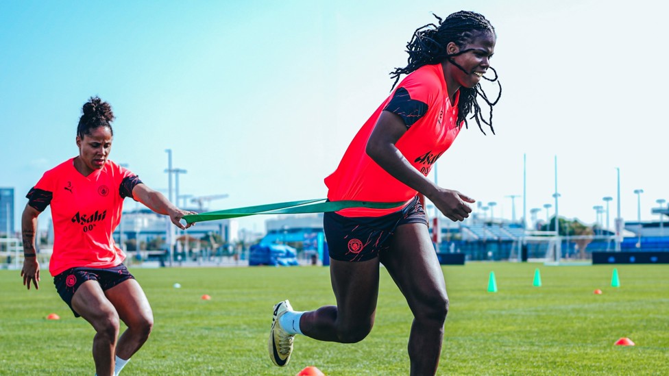 HARD YARDS : Demi Stokes and Bunny Shaw battle with the resistance band