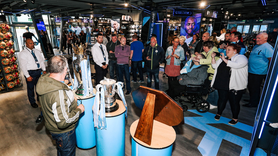 PICTURE PERFECT : Our fans were eager to check out the new-look store as well as being pictured with our trophies