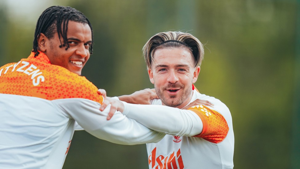 STRETCHING : Manuel Akanji and Jack Grealish provide each other support during stretching.