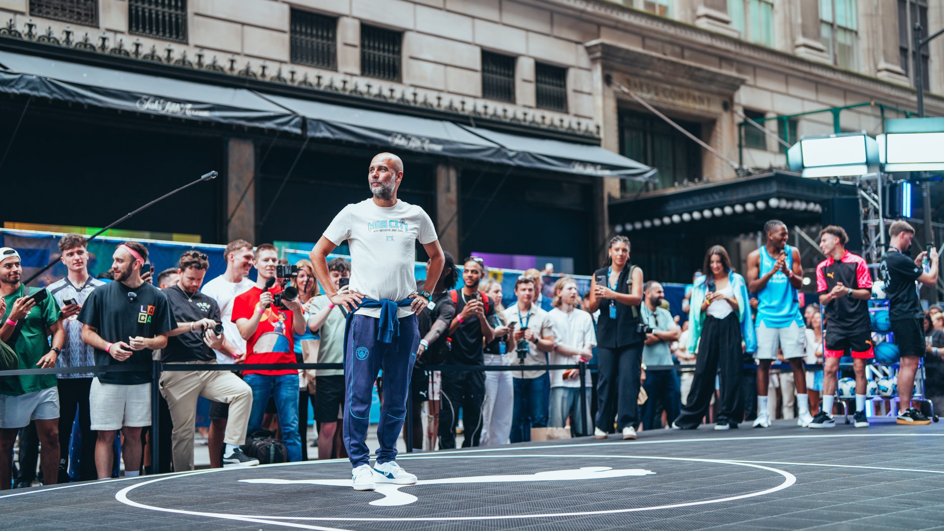 Man City star beam as he plays street basketball in New York in special outfit