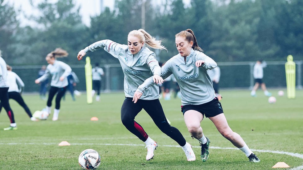 EYES ON THE PRIZE : Alex Greenwood and Keira Walsh tussle for possession