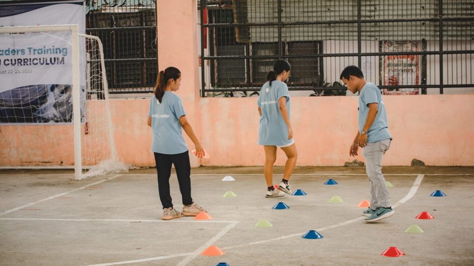  DEVELOPMENT: Young Leaders prepare a Football & WASH session.