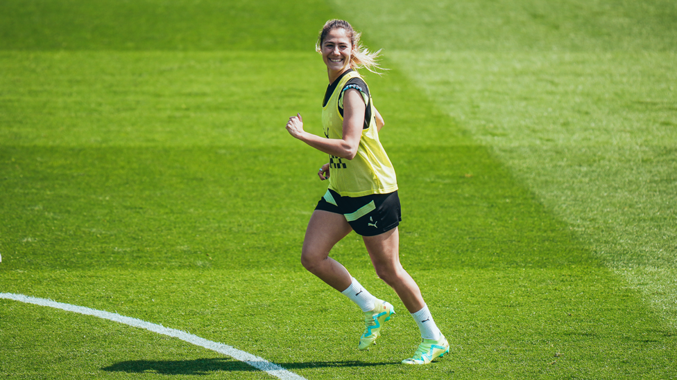 SUNSHINE SMILES : Laia Aleixandri jogs across the turf. 