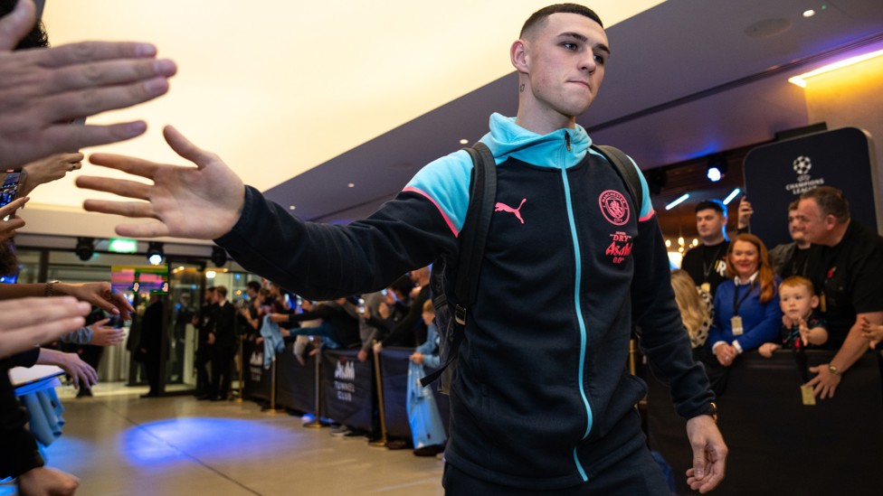 ONE OF OUR OWN : Foden greets the fans upon arrival.