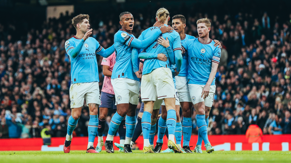 HAALAND HUGS : Erling feels the love after his goal.