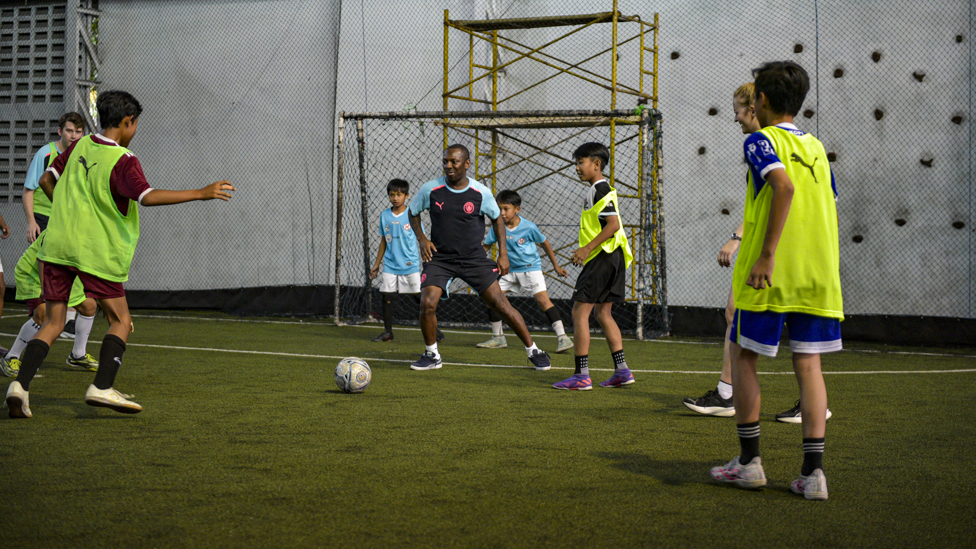 ON THE BALL : Shaun gets involved in a 5-a-side football session with project participants.