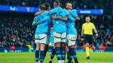 GROUP HUG: Gundogan feels the love!