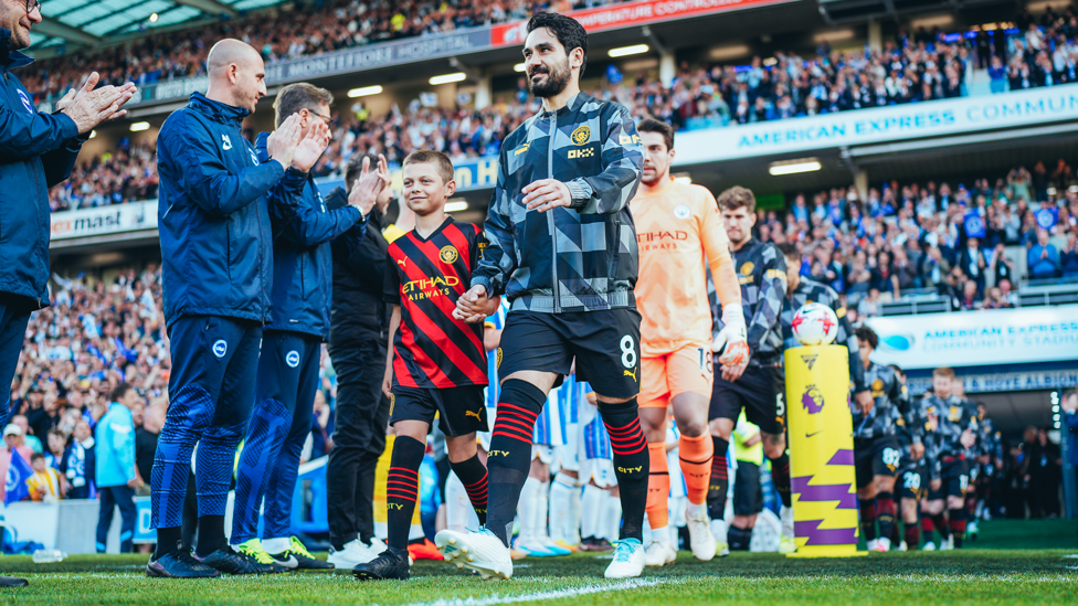 CHAMPIONS : City get a well deserved Guard of Honour from the Brighton team and staff.