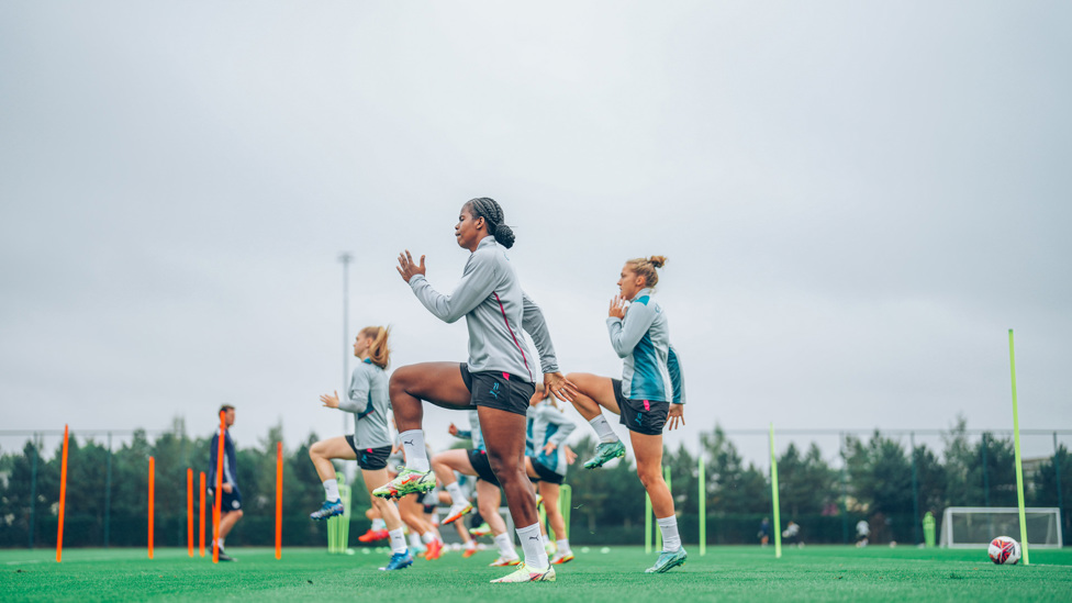 HIGH KNEES : The team limber up for Sunday's clash