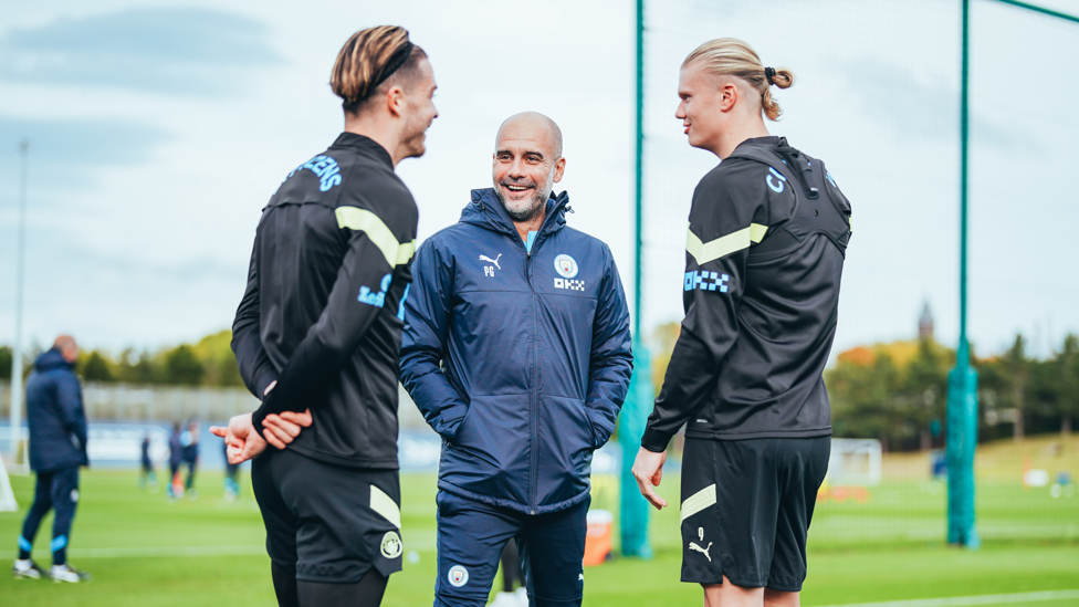 Pep enjoys a moment with Jack and Erling