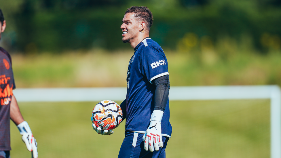 SAFE HANDS  : Ederson has the ball glued to his glove.