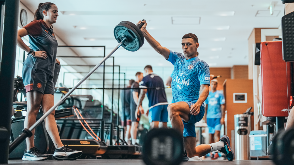 RAISE IT HIGH : Phil Foden is watched while he works