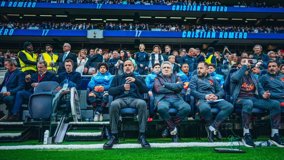 TEAM  : Pep Guardiola and his coaching staff take their seats.