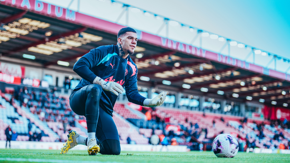 SAFE HANDS : Ederson warming up his gloves on a sunny afternoon. 