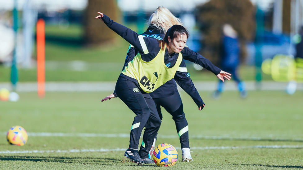 STRIKE A POSE : Hasegawa shields the ball