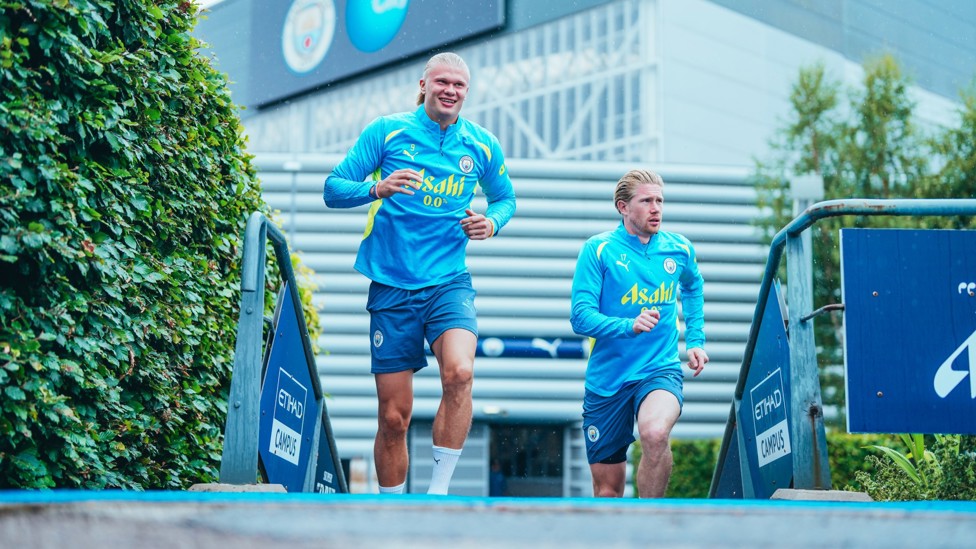 HEADING OUT  : Erling Haaland and Kevin De Bruyne make their way onto the pitch.