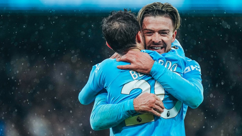 LATE DRAMA : Grealish is congratulated by Bernardo Silva after grabbing City's third