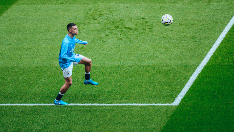 PHIL-ING GOOD : Substitute Foden gets in the mood during the pre-match warm up.