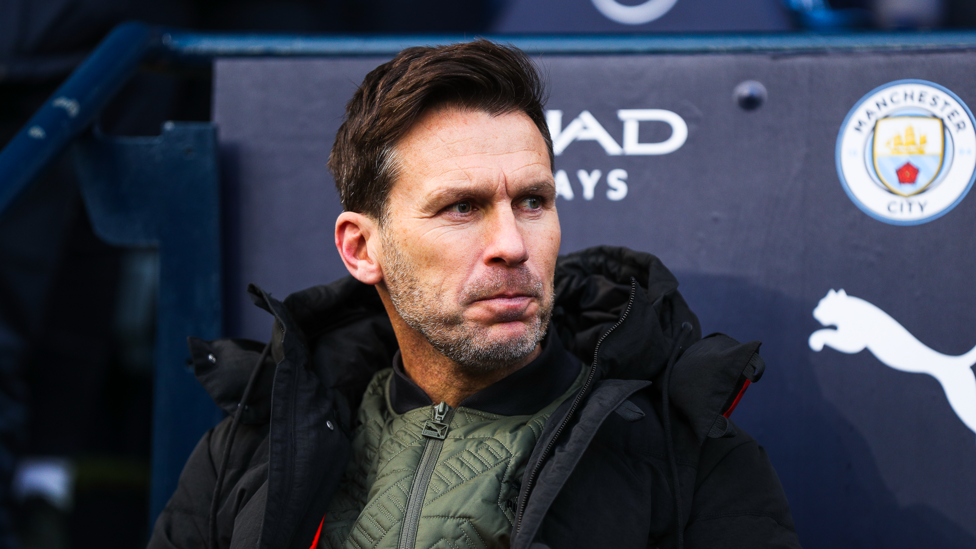 GAME FACE : Gareth Taylor takes his seat in the home dugout at the Etihad for the first time.