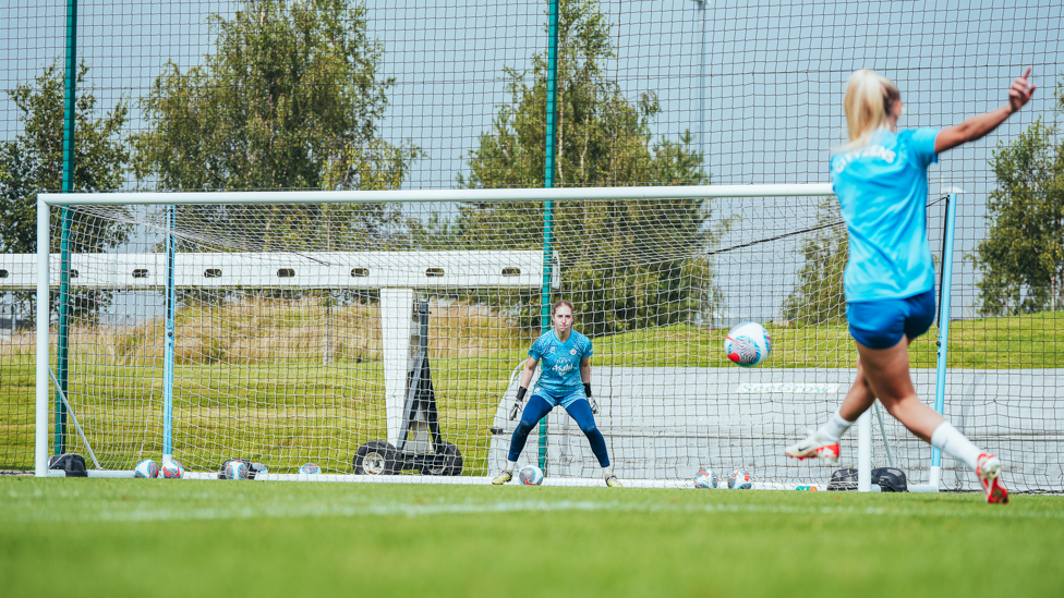 HAVING A GO : Sandy MacIver prepares to dive for this Laura Coombs strike