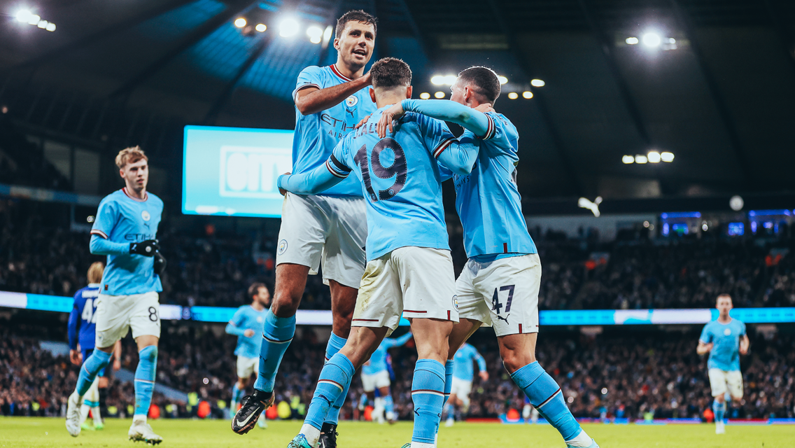 CENTRE OF ATTENTION: Alvarez feels the love after his goal.