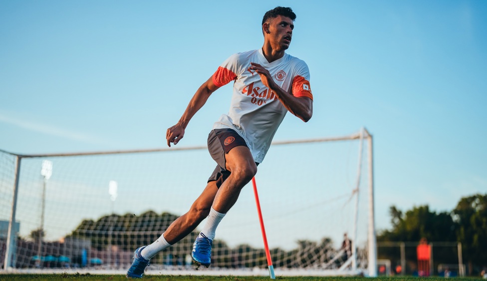 Matheus Nunes against a blue sky