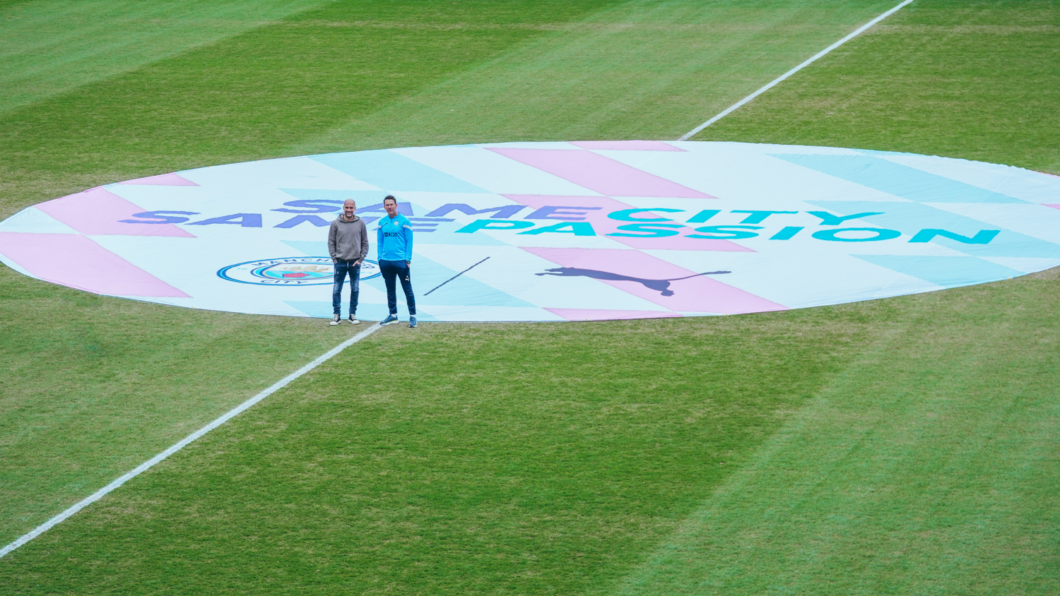 CENTRE STAGE : Pep Guardiola and Gareth Taylor pose with the Same City Same Passion centre circle