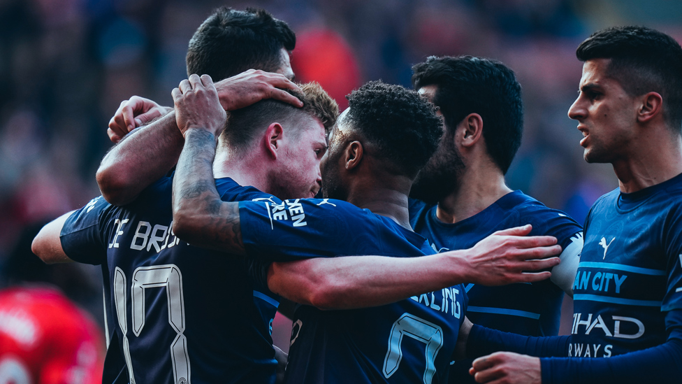 BACK IN FRONT  : The team celebrate KDB's goal. 