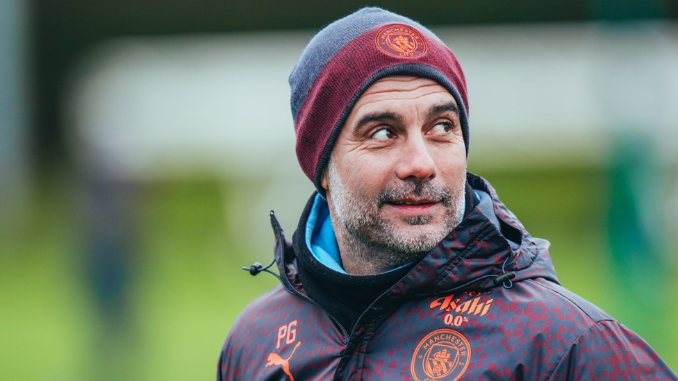 THE BOSS : Pep Guardiola looks over his shoulder during training.