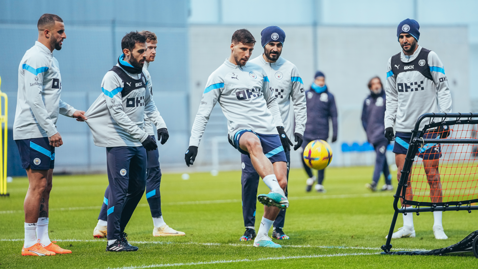 LOOK OUT : Ruben Dias is watched by his team-mates