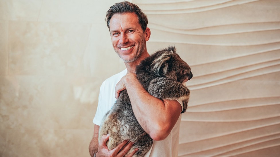 THE BOSS : Gareth Taylor gets his picture taken with a koala.