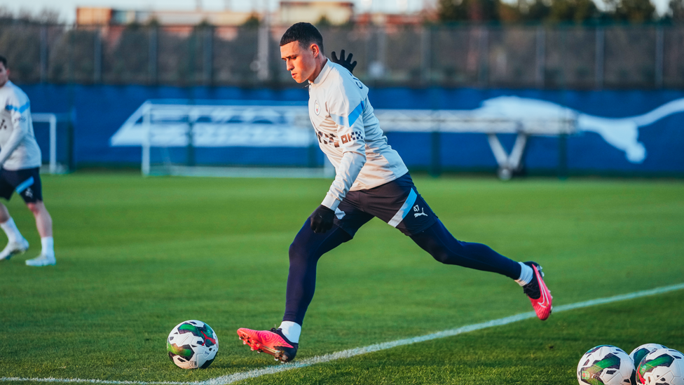 DOWN TO BUSINESS : After catching up with team-mates, Phil Foden gets stuck into training