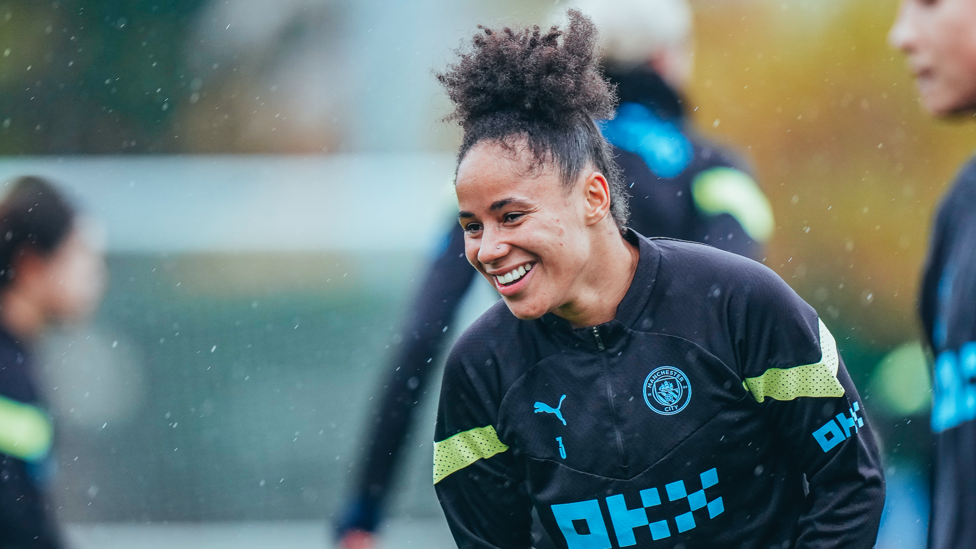 HIGH SPIRITS : A happy Demi Stokes in the wet Manchester weather