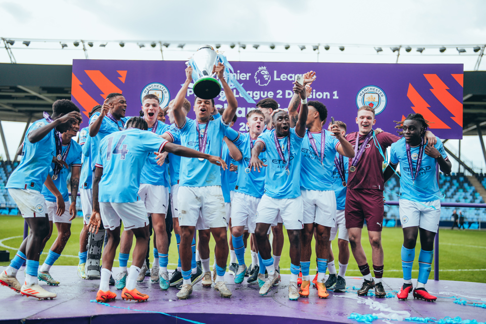 SUCCESS! : The team continued their celebrations on the stage with the trophy.