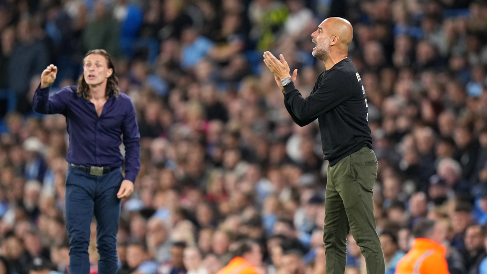 ENCOURAGEMENT  : Pep motivates the ranks from the side after Wycombe's opener