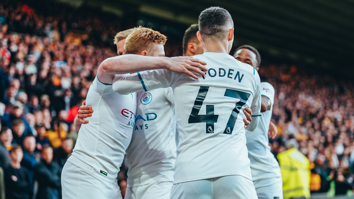 GROUP HUG: KDB feels the love.