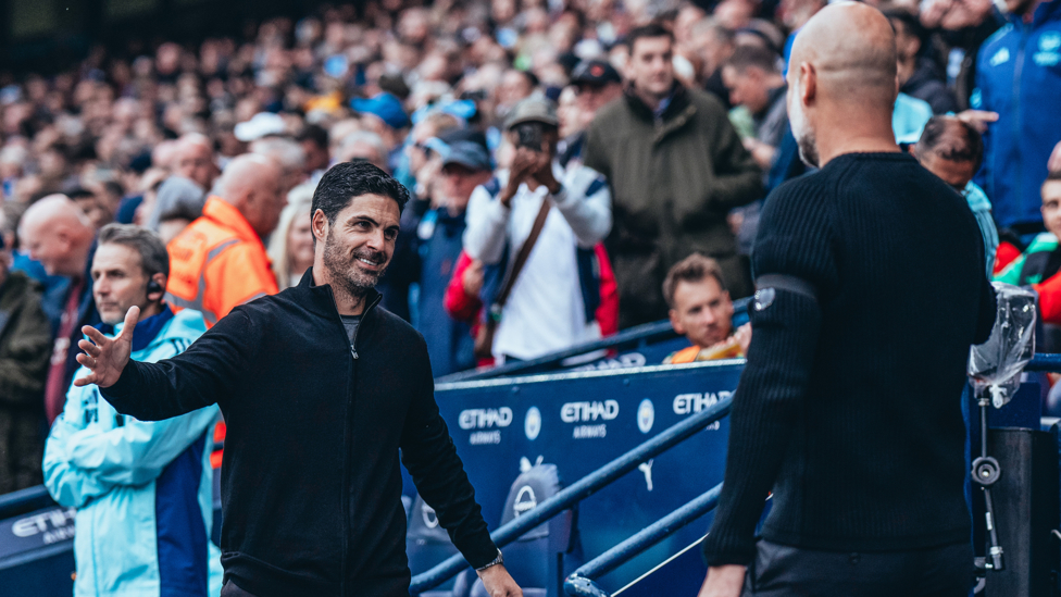 BOSSES : Guardiola and Arteta share a warm embrace ahead of kick-off.