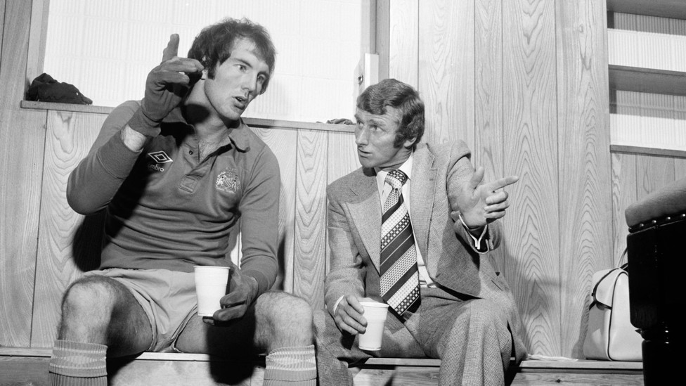 DEEP IN DISCUSSION : Boss Tony Book chats to goalkeeper Joe Corrigan in the dressing room at Maine Road