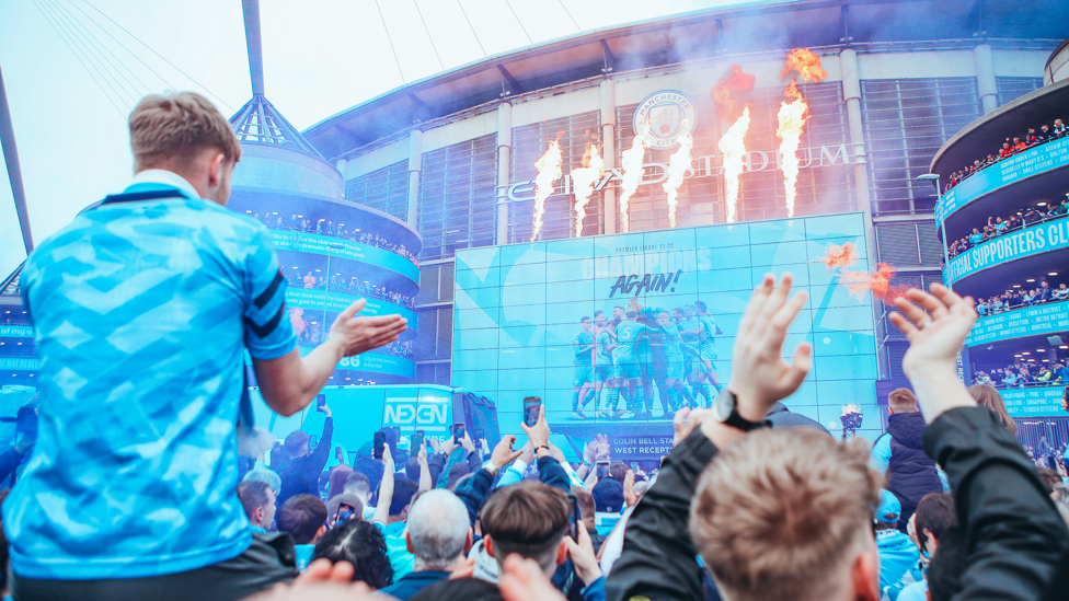 IT'S HEATING UP : A fire display increases the temperature at the Etihad as the players are greeted by fans.