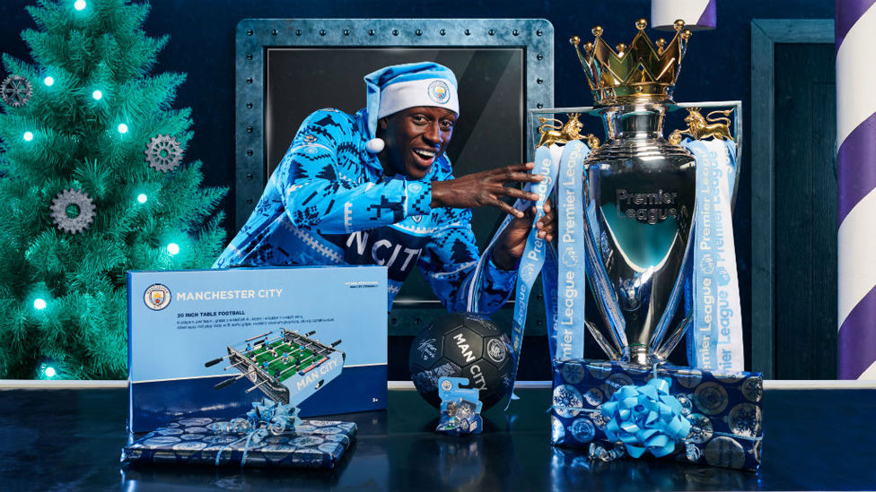 MINE : Benjamin Mendy makes a move for the Premier League trophy.