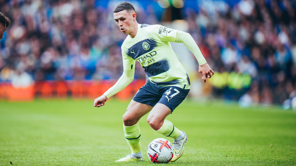 PHIL-ING IT : Foden looks for a way through the Everton defence.